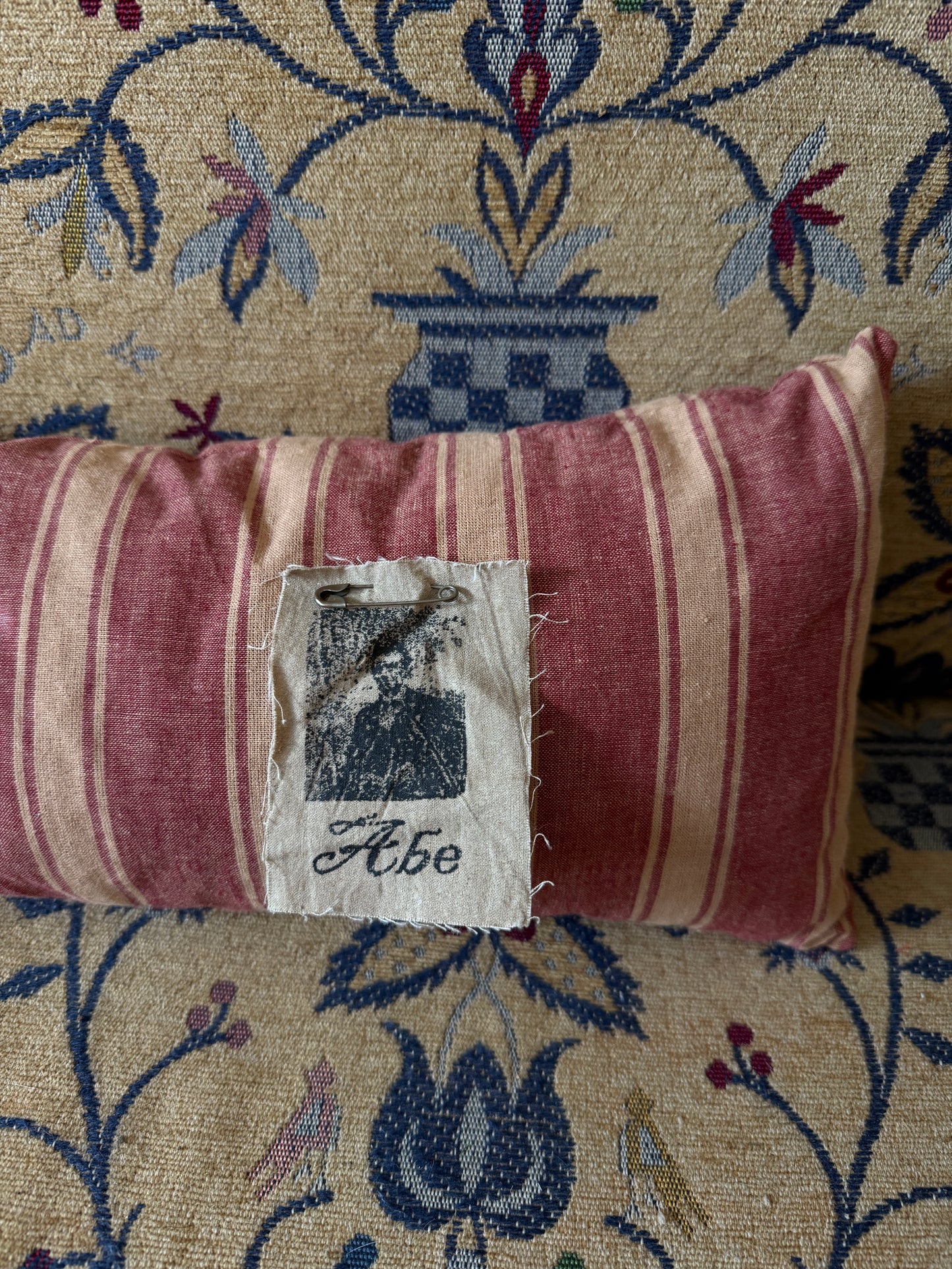 Red Striped Straw Filled Bolster Pillow with Abe Lincoln Photo