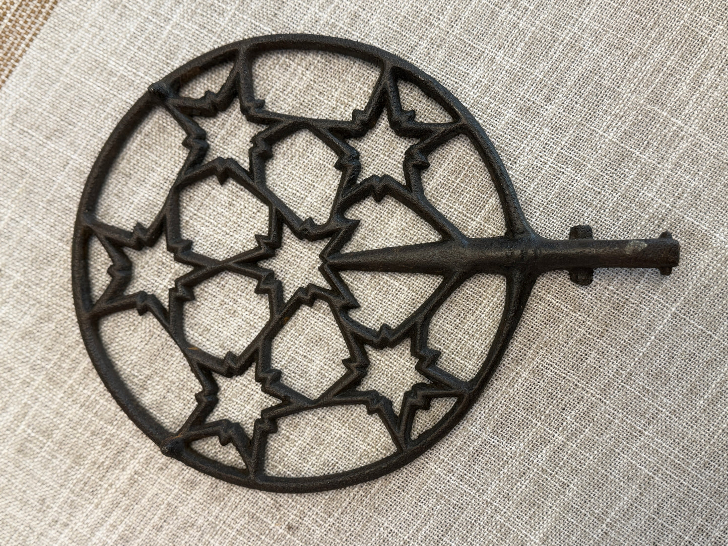 Antique Cast-Iron Trivet (Starburst / snowflake folky pattern)