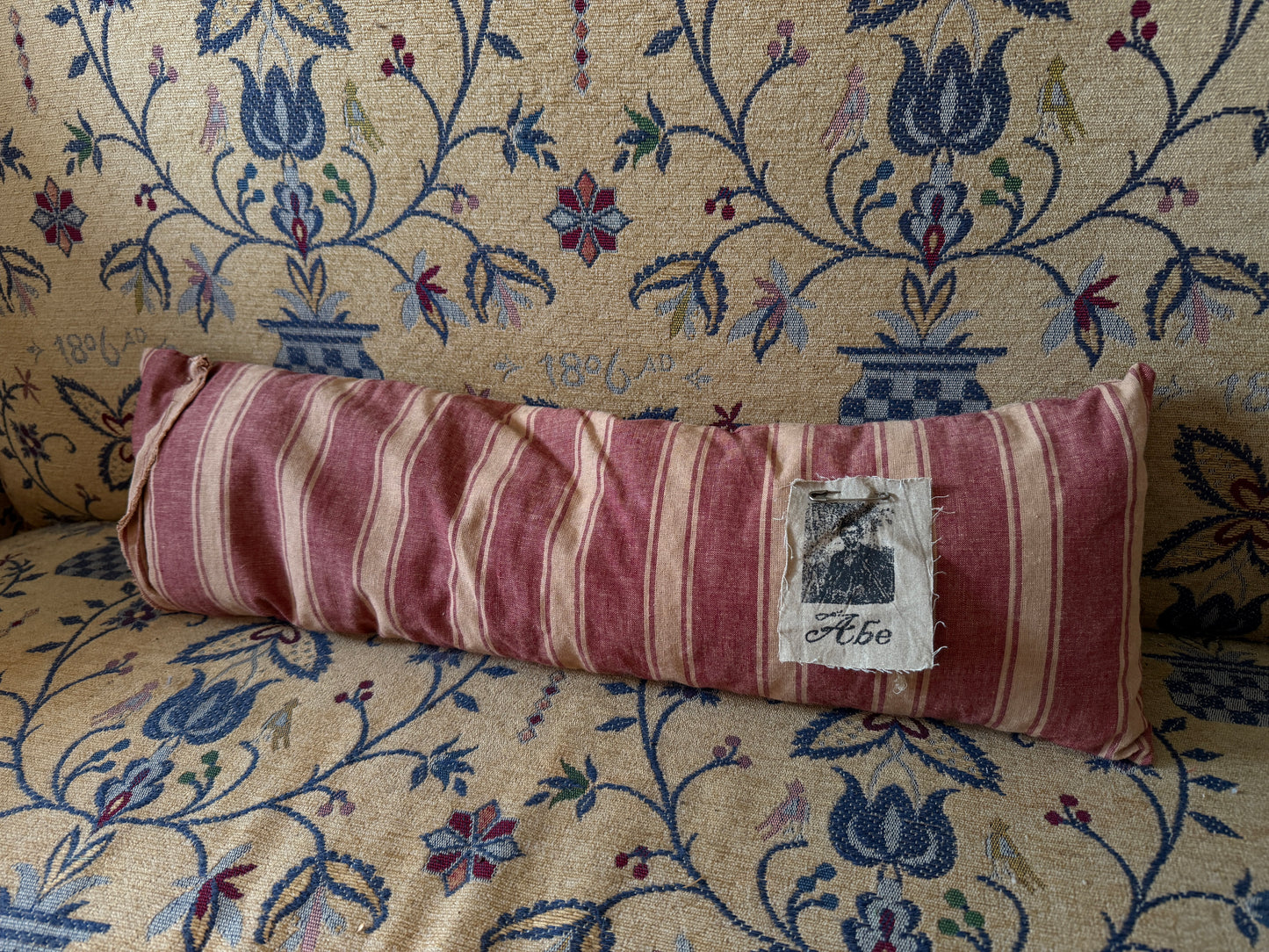 Red Striped Straw Filled Bolster Pillow with Abe Lincoln Photo